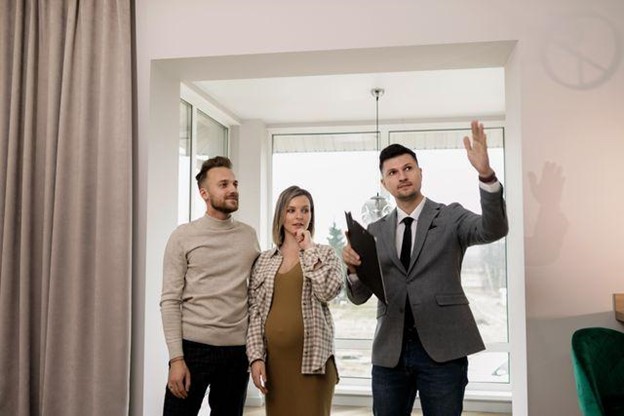 a landlord and tenants inspecting a unit at move-in